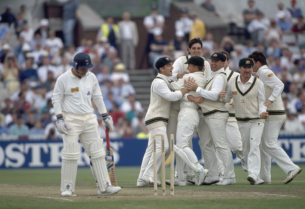Shane Warne is mobbed by team-mates after the Ball of the Century